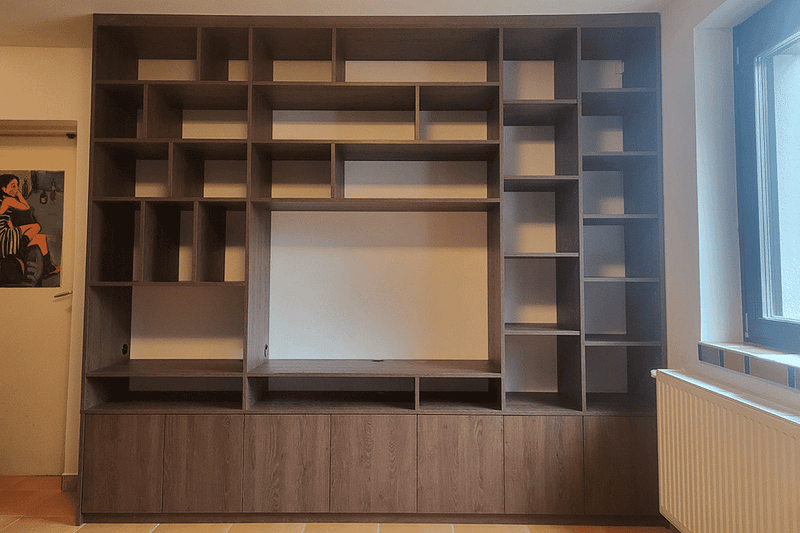 Custom-made living room wall unit with multiple shelves and storage compartments.