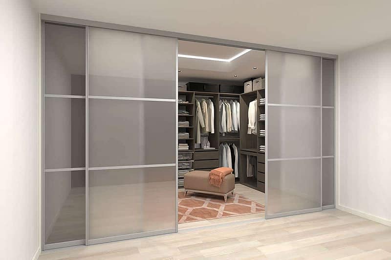 Custom wardrobe with sliding doors for organized storage.