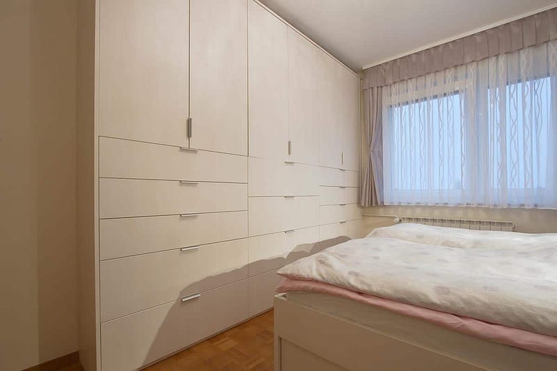Spalnice bedroom wardrobe with ample storage space.